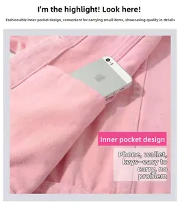 Detail showing functional inner pocket of pink denim jacket holding a smartphone