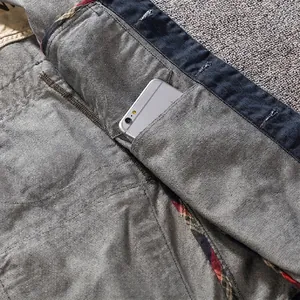Mens slim denim vest with functional inner pocket featuring classic plaid edge detail