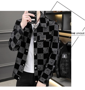 Detail of grey checkerboard casual jacket featuring star embroidery and textured fabric