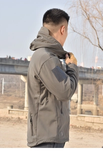 Tactical softshell jacket sleeve with adjustable velcro cuff and arm patch area