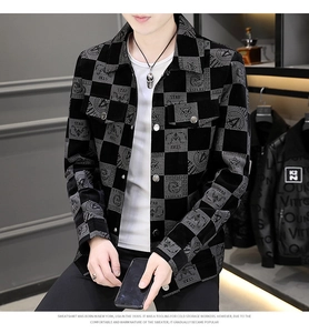 Detail of men's checkered jacket with turn-down collar and star venture print badges