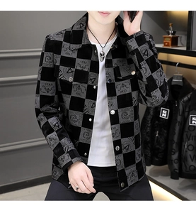 Close-up of men's casual checkered jacket with letter prints and retro badge details