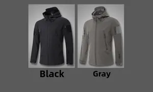 Detail of waterproof tactical jacket showing zippered multi-pocket system and velcro cuffs