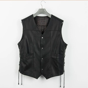 Detail of black faux leather vest featuring adjustable side lacing and V-neck design