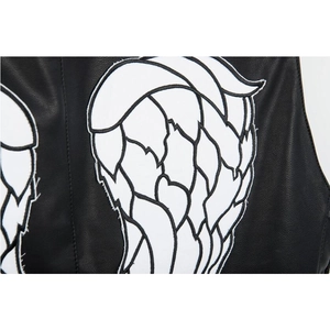 Close-up of white embroidered wing patches on black lychee texture leather biker vest