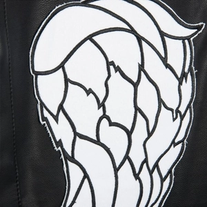 Detail of white embroidered angel wing patch on premium black leather biker vest