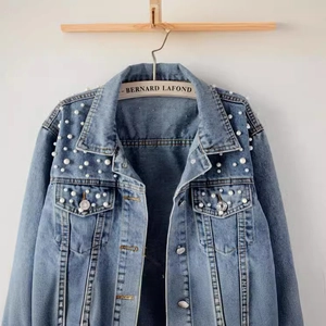 Light blue denim jacket for women featuring elegant white pearl bead embellishments