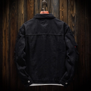Distressed black denim jacket for men featuring ripped sleeve details and a back view
