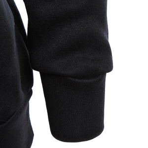 Close-up of the ribbed knit cuffs on a black oversized King Queen hoodie