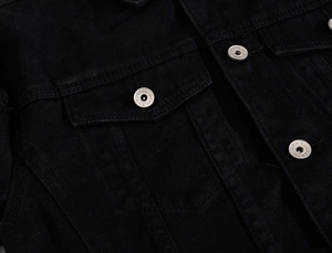 Distressed black denim jacket for men and women featuring metal buttons and chest pockets