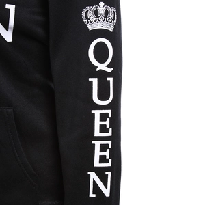 Detail of white Queen text and crown print on a black long-sleeved cotton hoodie sleeve