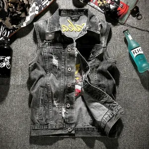 Slim fit grey distressed denim vest with embroidery, ripped details, and flat lay props
