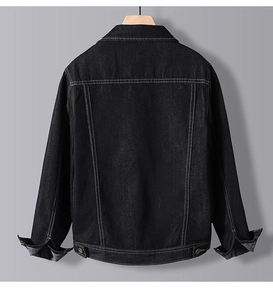 Vue arrière d'une veste en jean noir avec coutures contrastées blanches et boucles en métal