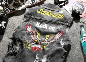 Detailed embroidery of eagle and rose on distressed grey denim vest with street style vibe