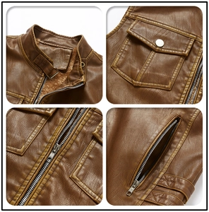 Close-up of vintage brown leather vest details including fleece lining and zippers