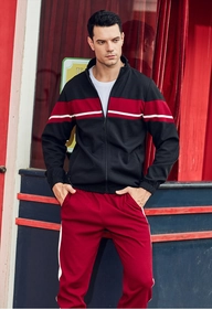 Detail of color block sports tracksuit with stand collar zipper jacket and side stripe pants