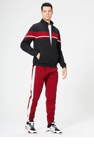 Detailed side view of men's two-piece tracksuit featuring red white side stripes
