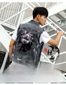 Detailed view of grey distressed denim vest with realistic tattoo embroidery on back