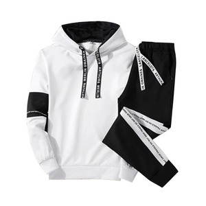 Detail view of men's hooded tracksuit featuring contrast piping and printed drawstring