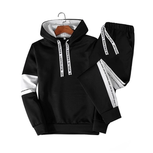 Detail of black men's hooded tracksuit featuring white branded side stripes and knit fabric