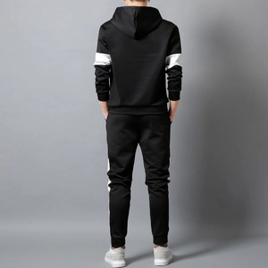 Rear view of men's black hooded tracksuit showing slim fit cut and white sleeve stripes