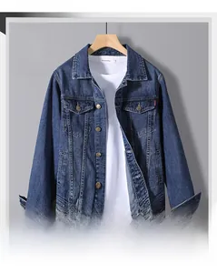 Front view of dark blue denim jacket with classic collar and metallic buttons