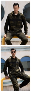 Detail of men's jungle camouflage tracksuit featuring hooded sweatshirt and joggers