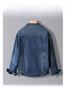 Detail of slim fit dark blue denim jacket showing premium stitching and metallic buckles