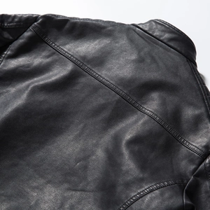 Detail of premium black PU leather bomber jacket back stitching and collar texture
