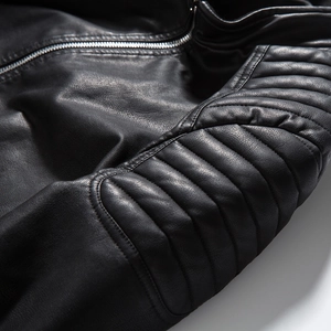Detail of premium black PU leather jacket with metal zipper and quilted stitching