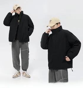 Detail view of black stand-collar puffer jacket with adjustable drawstring hem for men