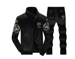Detail of black tracksuit with gold baroque patterns and Classical logo on chest