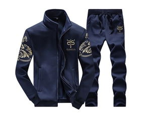 Close-up of golden embroidery and Classilal lettering on navy blue slim fit tracksuit