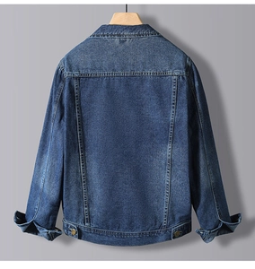 Rear view of a dark blue denim jacket with contrast stitching and adjustable hem buttons