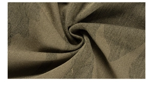 Macro view of olive green camouflage knit fabric texture and soft cotton material