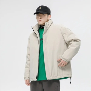 Detail of light gray high street jacket with stand collar and elastic ribbed cuffs