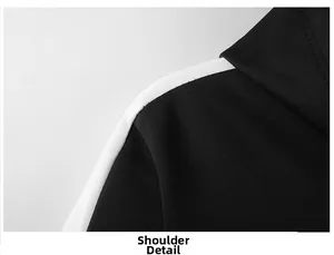 Détail de la couture d'épaule et de la bande blanche décorative sur un sweat à capuche noir