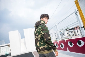 Macro shot of hooded camo sweatshirt showing classic jungle pattern on rooftop