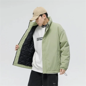 Detail of light bean green men's padded jacket with stand collar and windproof cuffs