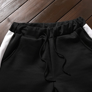 Pantalon de jogging noir pour hommes avec bandes blanches et cordon de serrage