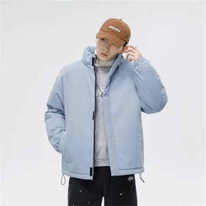 Detail of light blue men puffer jacket with stand collar, elastic cuffs and drawstring hem