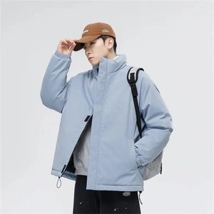 Close-up of a light blue high street oversized puffer jacket with elasticated cuffs