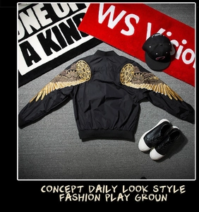 Detailed gold wing embroidery on a black MA-1 bomber jacket with nylon finish
