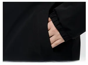 Detail of windproof jacket showing side pocket and elastic cuffs in smooth polyester