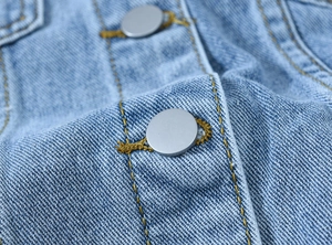 Vintage loose light blue denim jacket with retro metal buttons and contrast stitching