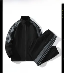 Detail of black sports jacket suit with gray diagonal stripes and drawstring waistband