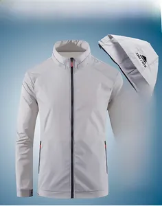 Detail of light grey men's sun protection jacket with a detachable hood and black zipper