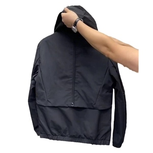 Men's black hooded windbreaker jacket with waterproof texture and back zipper detail