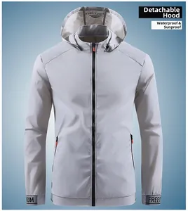 Close-up of men's grey sun protection jacket featuring hood and freedom strap detail