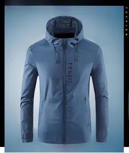 Detail showing the lightweight blue hooded sun protection jacket with TRNEO logo and zipper